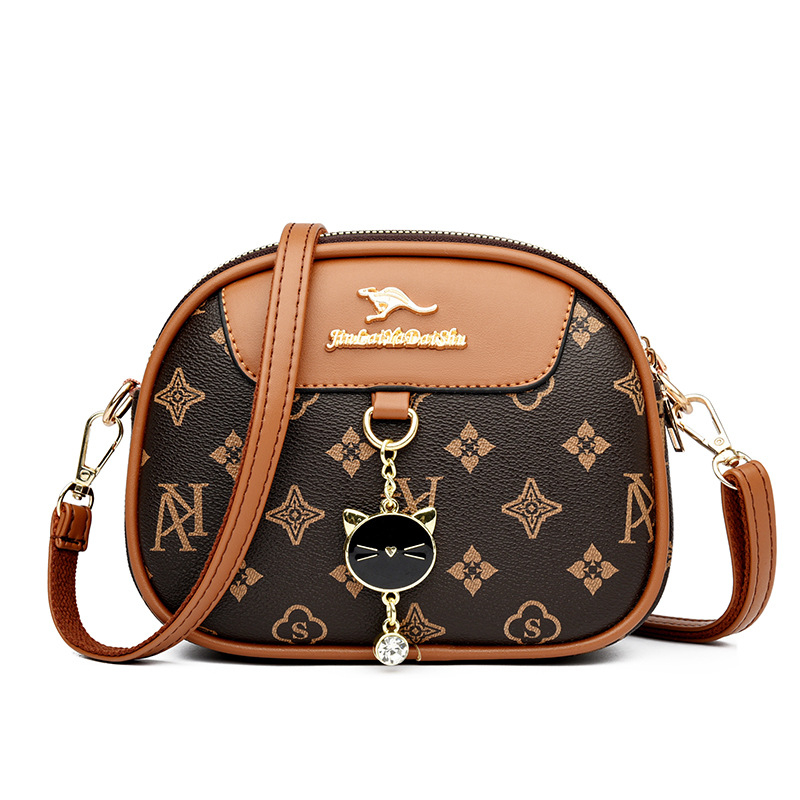Ženska mala okrugla crossbody torba, mekana koža