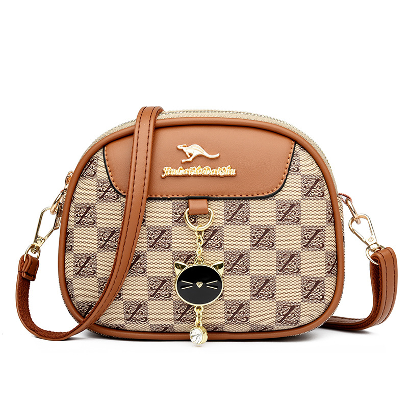 Ženska mala okrugla crossbody torba, mekana koža