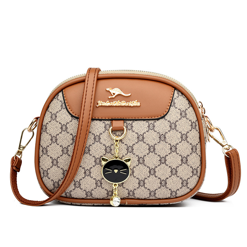 Ženska mala okrugla crossbody torba, mekana koža