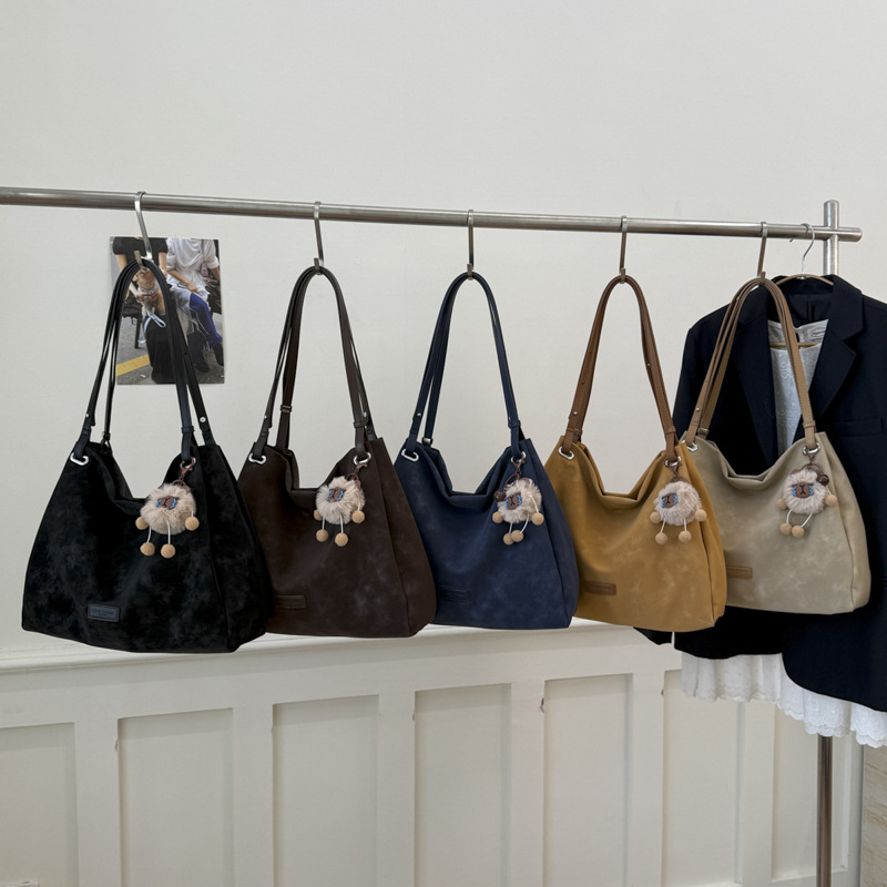 Ženska torba u korejskom retro stilu s velikim kapacitetom, model 2026, elegantna dnevna tote torba za nošenje na rame ili crossbody.