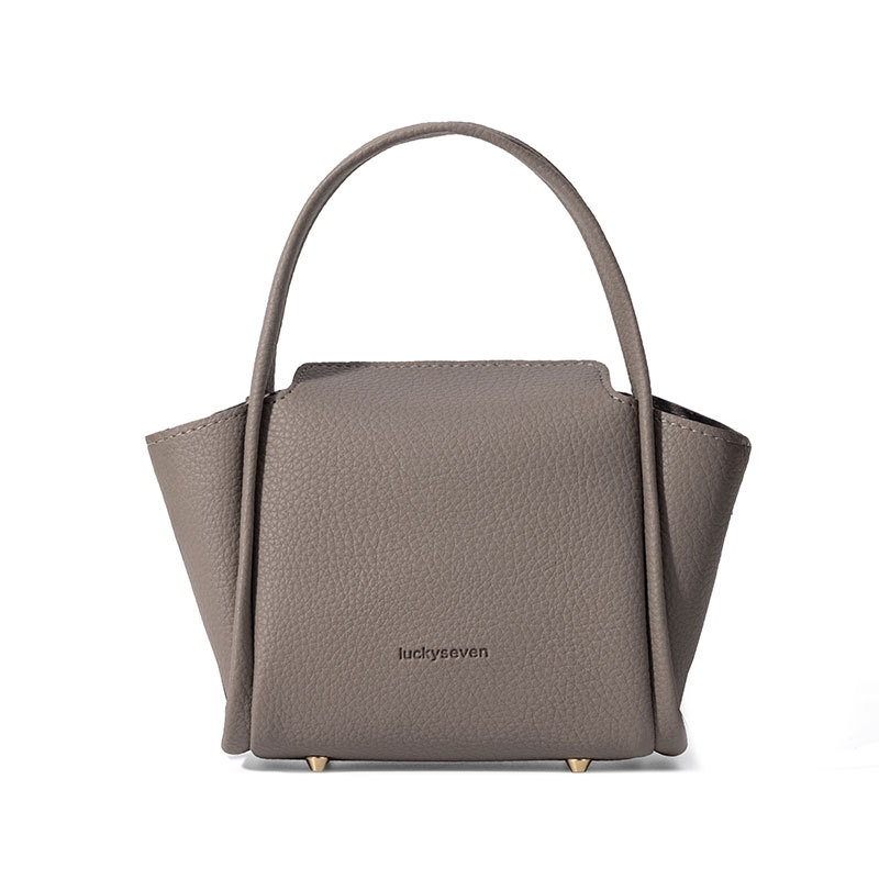 2025 minimalistička jednobojna kanta torba, nišnog dizajna, inspirirana košarom za povrće, zapadnjački stil, svakodnevna crossbody torba.