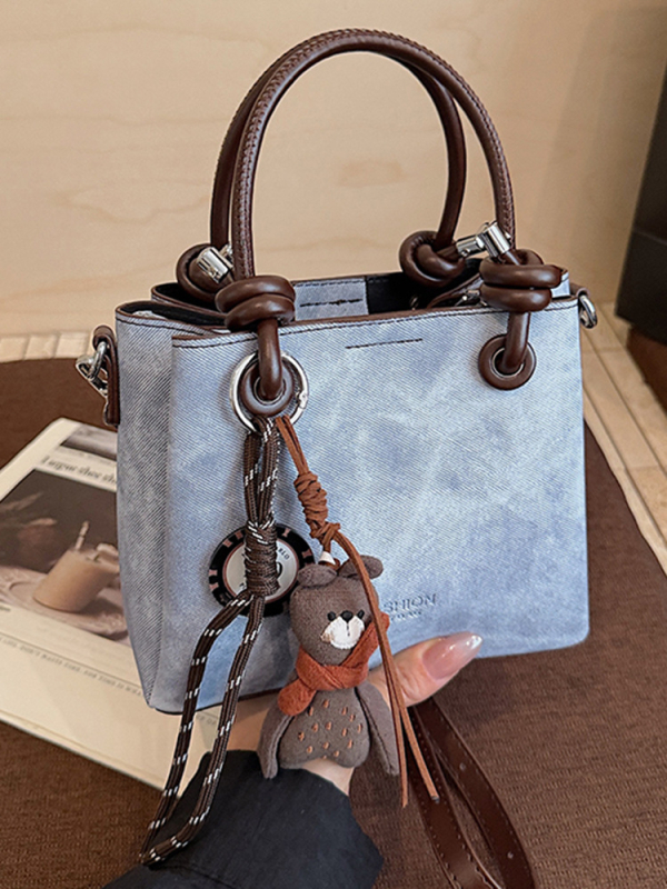 Mala crossbody torba tipa bucket sa zatvaračem, gradski minimalistički dizajn, retro inspiracija
