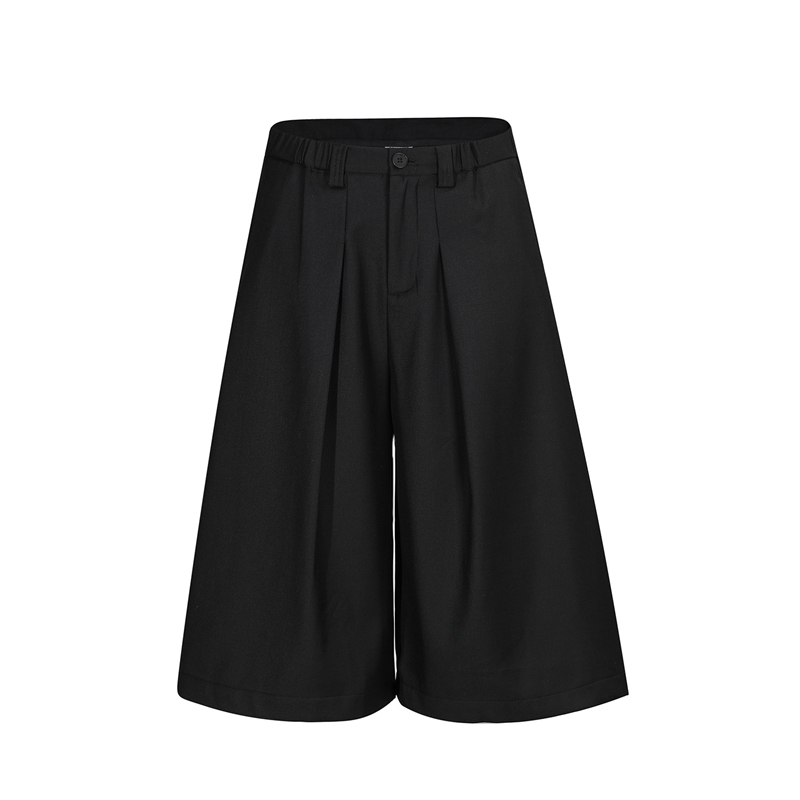 Egyszínű, széles lábú nadrág plisírozott, drapírozott sziluettel, fél rugalmas derekú, cropped hossz, uniszex casual nadrág.