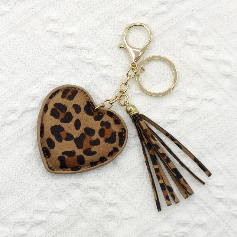 Privjesak za torbu od umjetne kože s leopard uzorkom, srcolik resica i ključni krug.