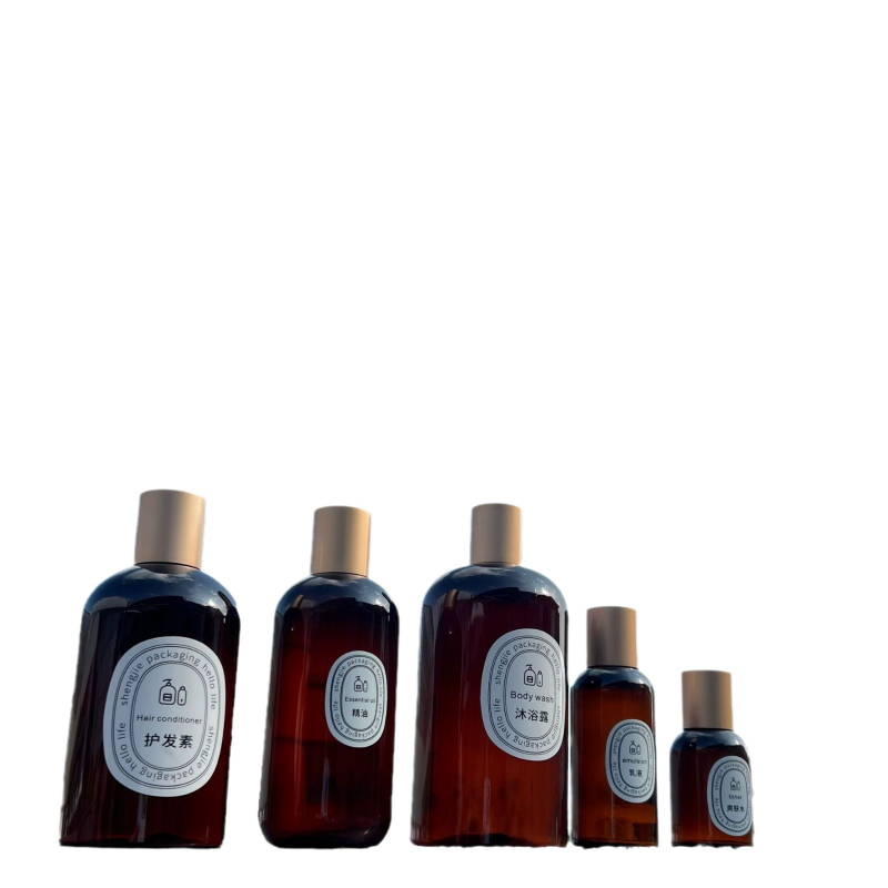 Karamellbarna átlátszó kozmetikai flakon 200 ml arany kupakkal