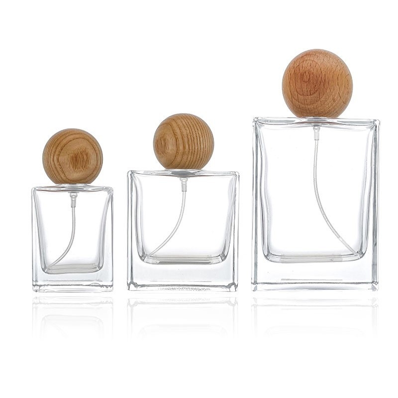 Kiváló minőségű négyszögletes üveges parfümösüveg fa kupakkal, csavaros kupakkal, 30 ml, 50 ml, 100 ml