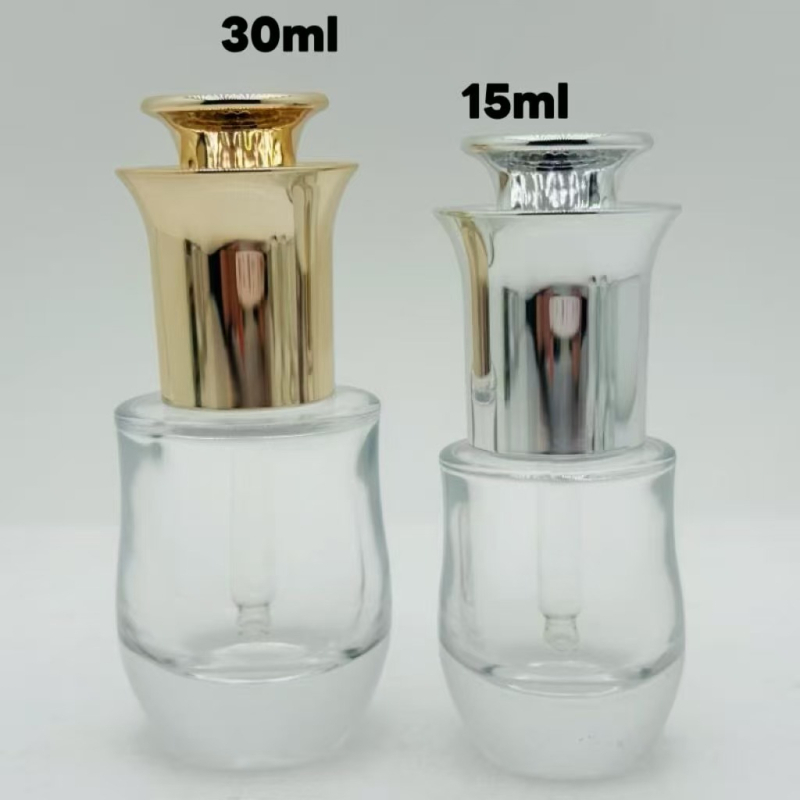 Staklena boca s ploskim ramenima i debelim dnom, pumpa za doziranje za esencijalna ulja, losione i serume, kapaciteti 15 ml i 30 ml