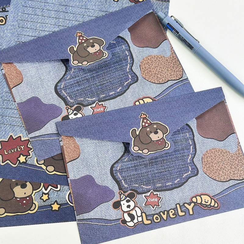 Set omotnica i papir za pisanje s crtani lutkom u denim boji — kreativni poklon za uspomenu