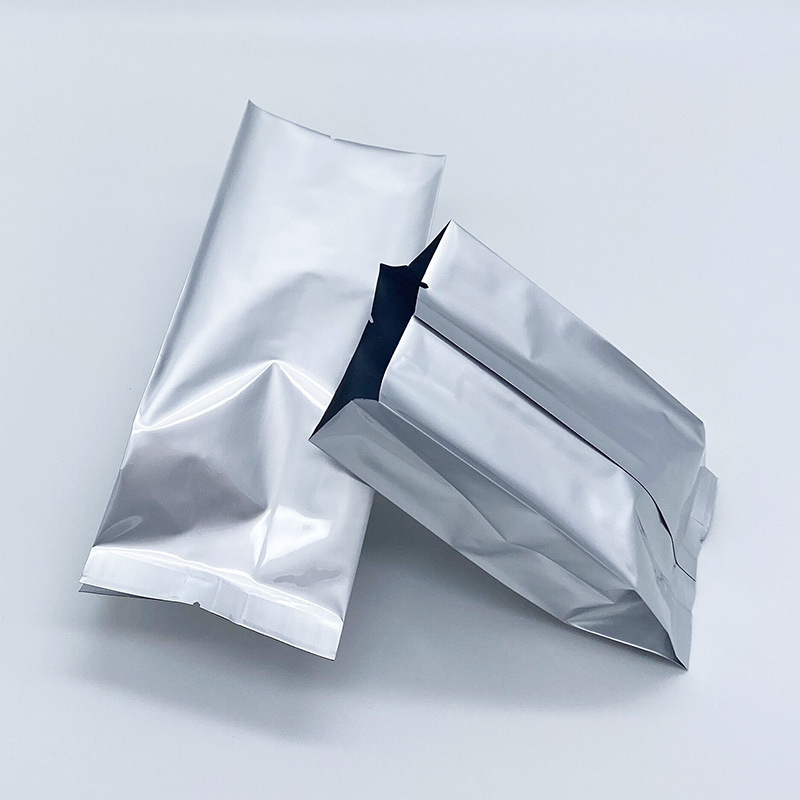 Pungă din folie de aluminiu pură, cu buzunar cu pliere (gusset), sigilare centrală și sigilare pe spate, pentru ceai, pulberi și boabe de cafea