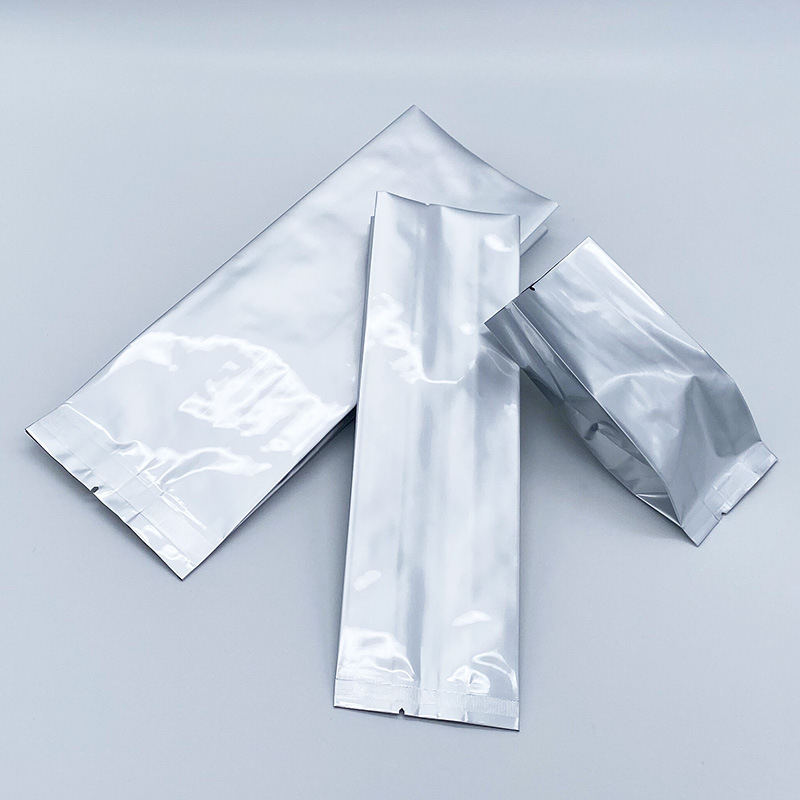 Pungă din folie de aluminiu pură, cu buzunar cu pliere (gusset), sigilare centrală și sigilare pe spate, pentru ceai, pulberi și boabe de cafea