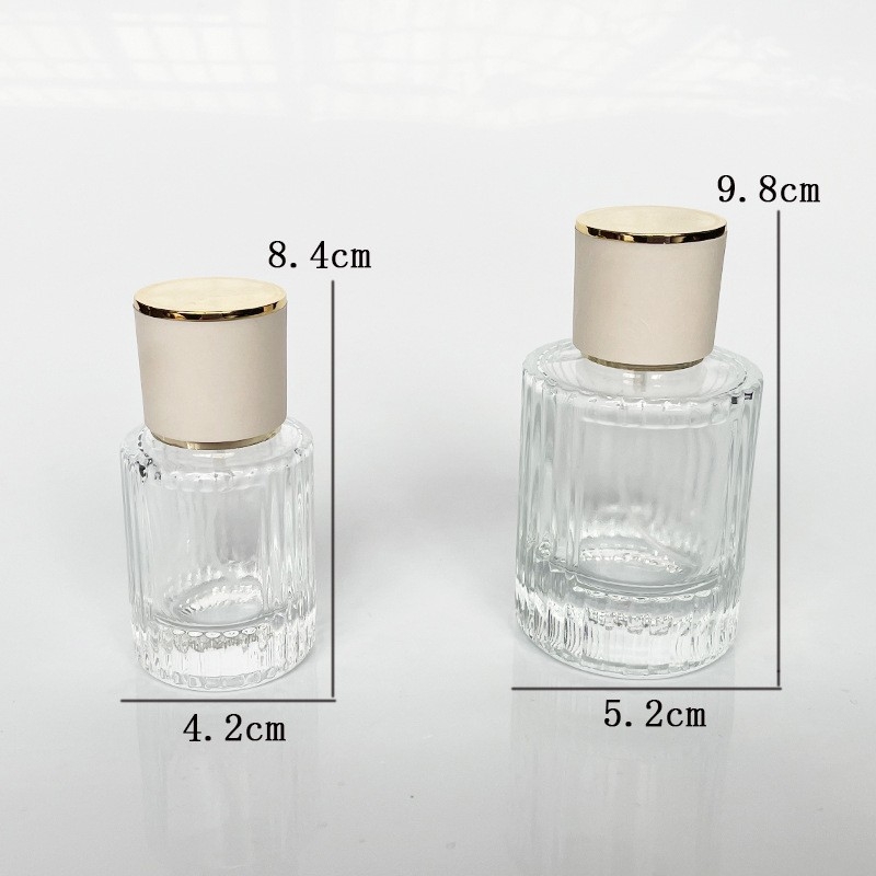Átlátszó henger alakú parfümös üveg, üres, 30ml/50ml permetezővel
