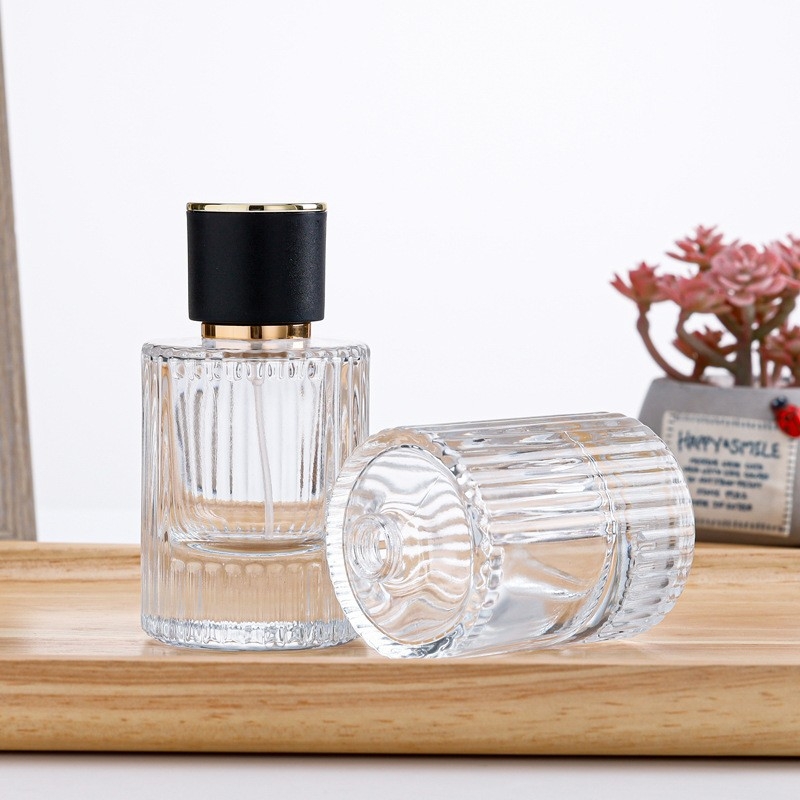 Átlátszó henger alakú parfümös üveg, üres, 30ml/50ml permetezővel