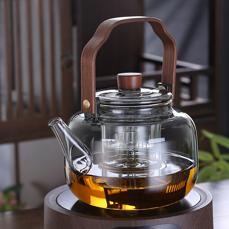 Ceainic din sticlă, cu mâner din lemn, capacitate 1200 ml, sistem combinat de abur și fierbere, culoare fumurie, pentru ceai negru