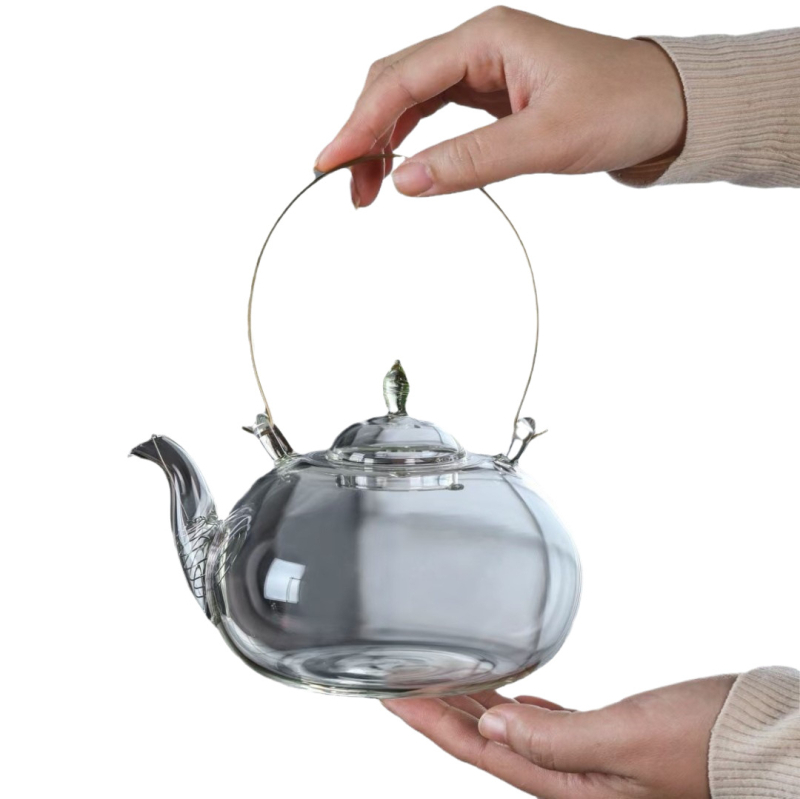Ceainic din sticlă borosilicată, mâner din cupru, filtru încorporat