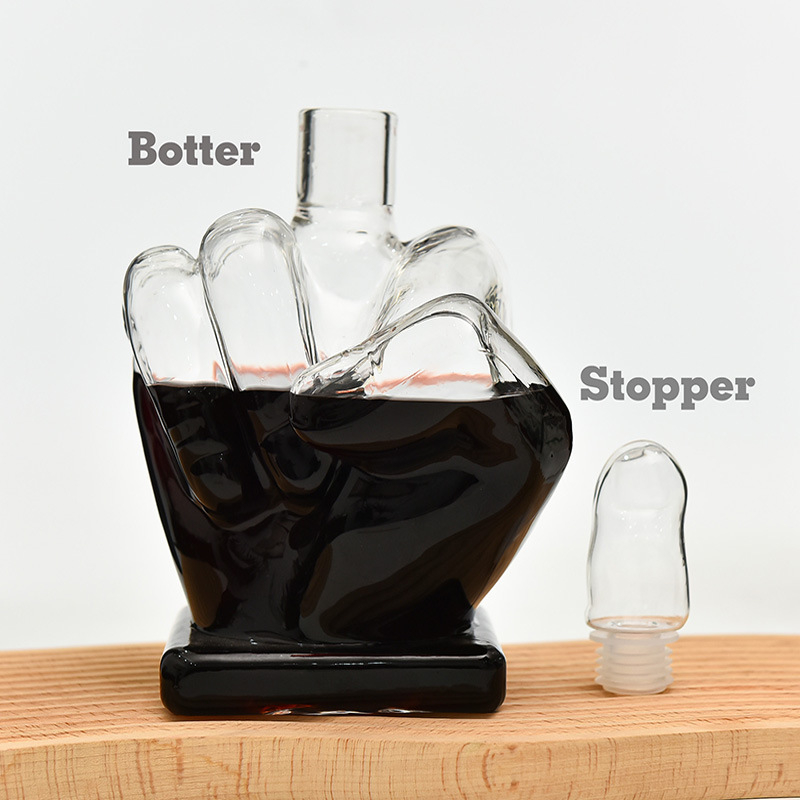 Decantor de sticlă sigilat, în formă de deget mijlociu, pentru whisky