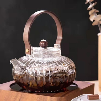 Ceainic din sticlă borosilicat rezistent la temperaturi înalte, cu filtru și mâner din lemn, pentru prepararea ceaiului acasă