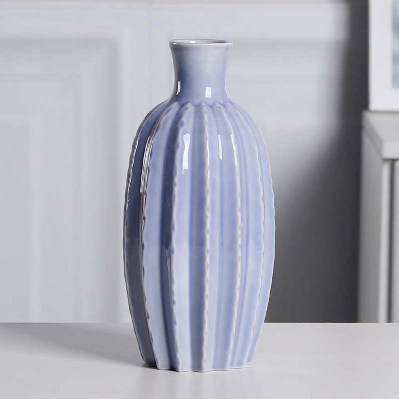 Vază ceramică minimalistă, în formă de carambolă, pentru decor acasă, potrivită pentru aranjamente florale proaspete în living și pe masă.