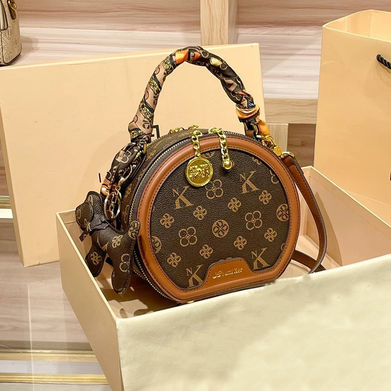 Ženska PU kožna mala okrugla crossbody torbica s otiskom, vintage stil – trend 2025