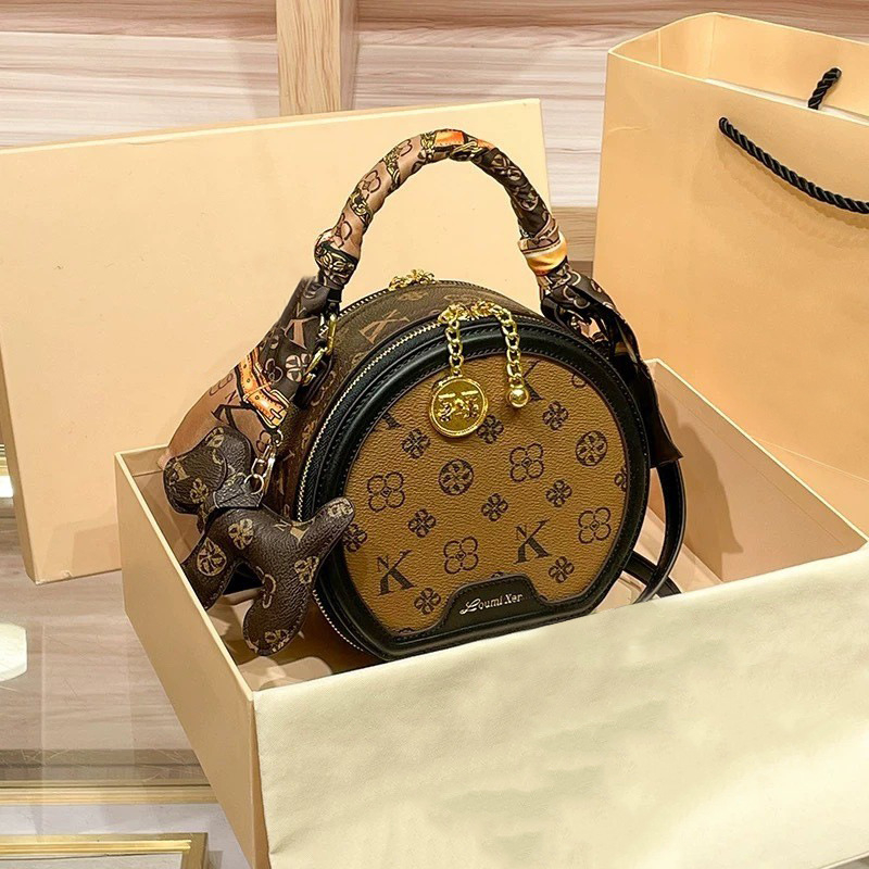 Ženska PU kožna mala okrugla crossbody torbica s otiskom, vintage stil – trend 2025