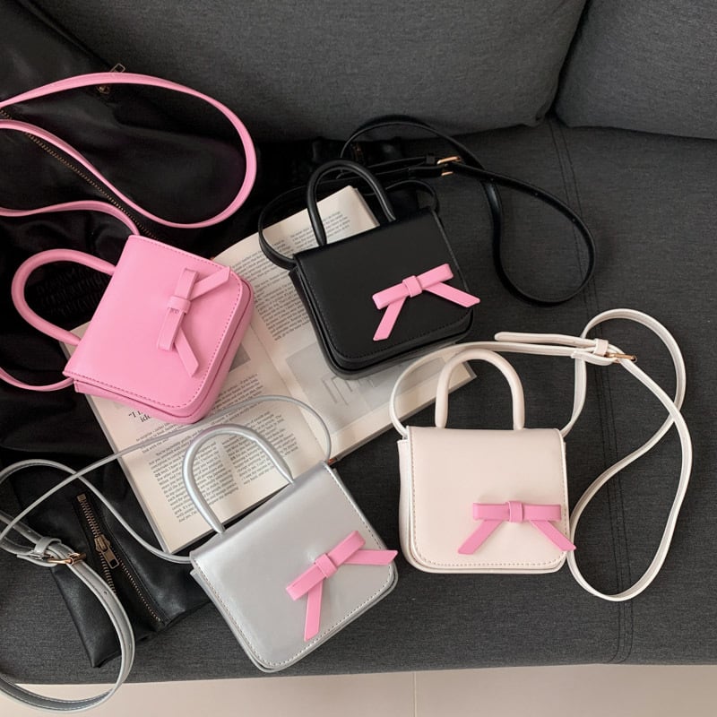 Ženska mini kvadratna torba s mašnom u kontrastnim bojama, crossbody torba