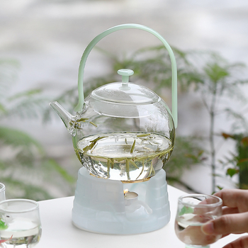 Ceainic din sticlă borosilicată cu mâner, design modern minimalist, sistem de separare ceai-apă, rezistent la temperaturi înalte, fabricat parțial manual