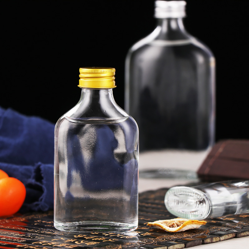 50 ml prazna boca za liker, prozirna plosnata staklena boca za voćno vino, zatvoren dozator