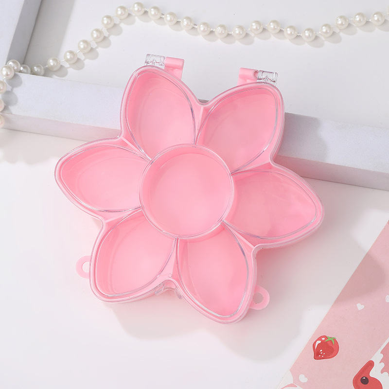 Cutie transparentă din plastic cu floare roz și iepuraș, capac rabatabil, compartimente pentru bijuterii și accesorii, design în stil castel