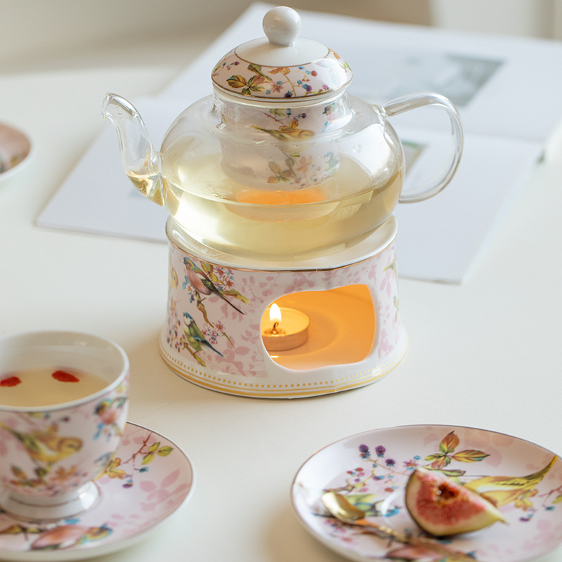 Set de ceai în stil britanic, cu pasăre roză și ceainic floral; încălzire cu lumânare pentru ceai de fructe