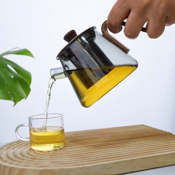 Ceainic din sticlă borosilicat rezistentă la temperaturi înalte, cu mâner din lemn și infuzor din oțel, compact pentru birou