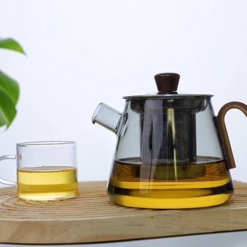 Ceainic din sticlă borosilicat rezistentă la temperaturi înalte, cu mâner din lemn și infuzor din oțel, compact pentru birou