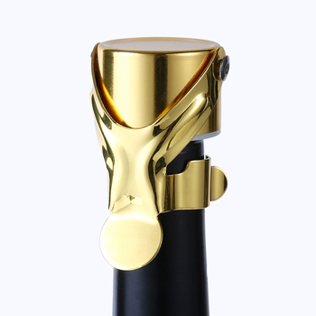 Stopper de vin din metal, formă umanoidală, finisaj auriu; sigilează sticlele de vin roșu și șampanie, păstrând prospețimea.