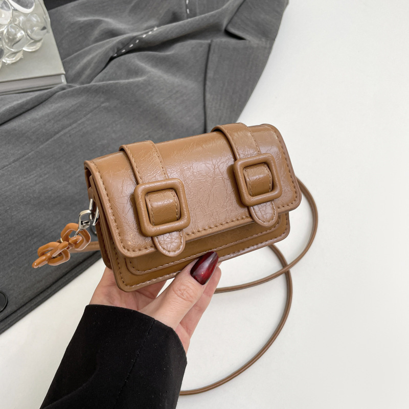 Mini ženska crossbody torba s laserskom lancem, ljeto 2025, vrhunska tekstura, mala kvadratna torba s džepom za ruž