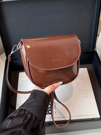 Ženska sedlasta torbica preko ramena, mala crossbody, PU koža, 2026 gradski stil