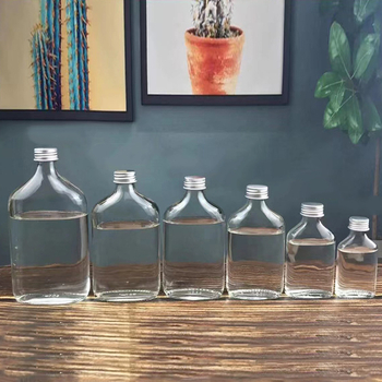 Staklene bočice za piće s mat završetkom i malim otvorom, set kapaciteta 50 ml, 100 ml, 200 ml, 250 ml, 350 ml i 500 ml, pogodne za bijelo vino, u kartonskom pakiranju u obliku jajeta
