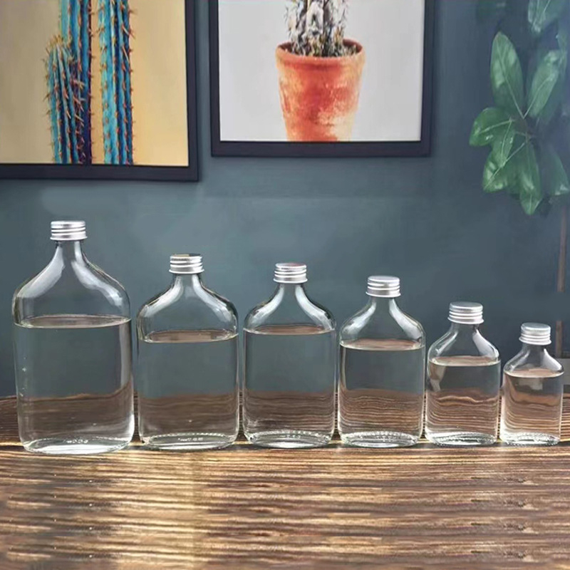 Staklene bočice za piće s mat završetkom i malim otvorom, set kapaciteta 50 ml, 100 ml, 200 ml, 250 ml, 350 ml i 500 ml, pogodne za bijelo vino, u kartonskom pakiranju u obliku jajeta