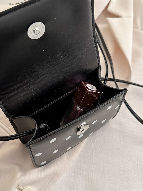 Mini crossbody torbica s točkastim uzorkom i elegantnom teksturom