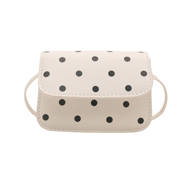 Mini crossbody torbica s točkastim uzorkom i elegantnom teksturom