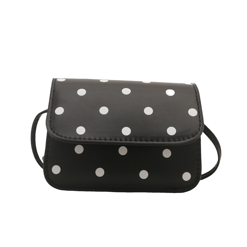 Mini crossbody torbica s točkastim uzorkom i elegantnom teksturom