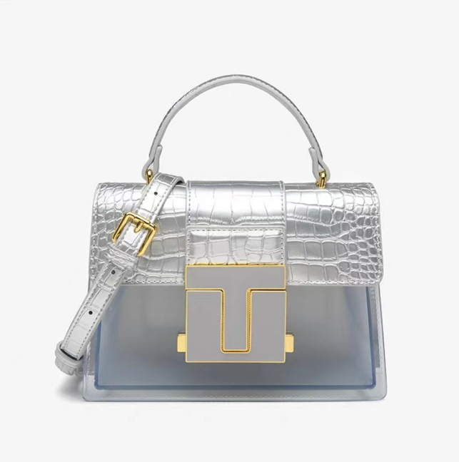 Ženska torbica Saddle s uzorkom krokodila, prozirni paneli i dizajn s blok boja; nosi se na ramenu ili crossbody