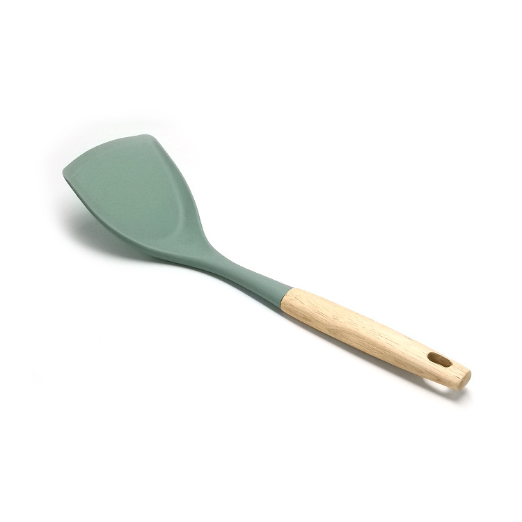 Set din silicon pentru bucătărie, 6 piese, cu mâner din lemn — antiaderent, rezistent la căldură; include spatulă, lingură de supă și lingură cu sită.