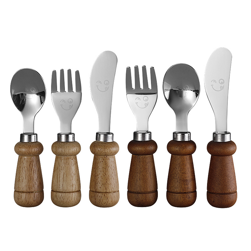 YIQI Set de tacâmuri pentru copii din oțel inoxidabil cu mâner din lemn, 304, cu un design zâmbitor – lingură, furculiță, cuțit pentru steak, cuțit de brânză