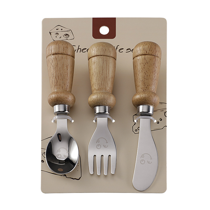 YIQI Set de tacâmuri pentru copii din oțel inoxidabil cu mâner din lemn, 304, cu un design zâmbitor – lingură, furculiță, cuțit pentru steak, cuțit de brânză