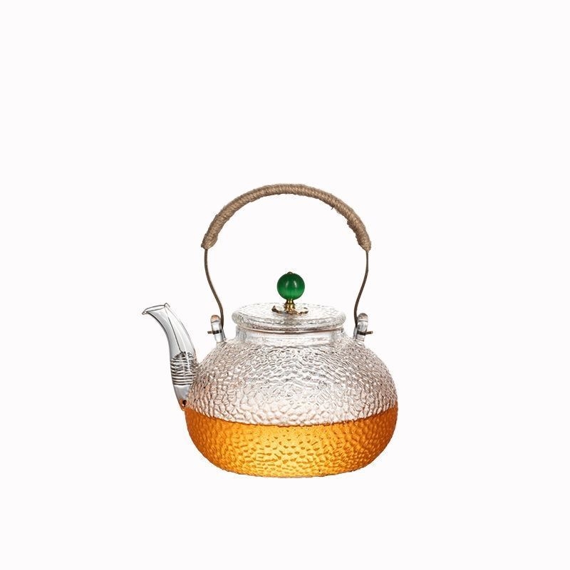 Ceainic din sticlă borosilicată cu mâner, model ciocănat; potrivit pentru plite electrice ceramice; poate fi folosit ca ceainic de ceai sau de apă, în formă de dovleac