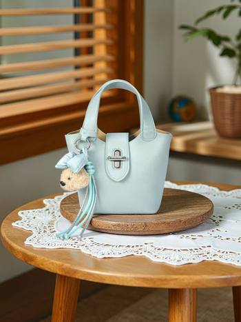 Ženska plava vedierova torbica Sea Salt s ramenskim i crossbody remenom