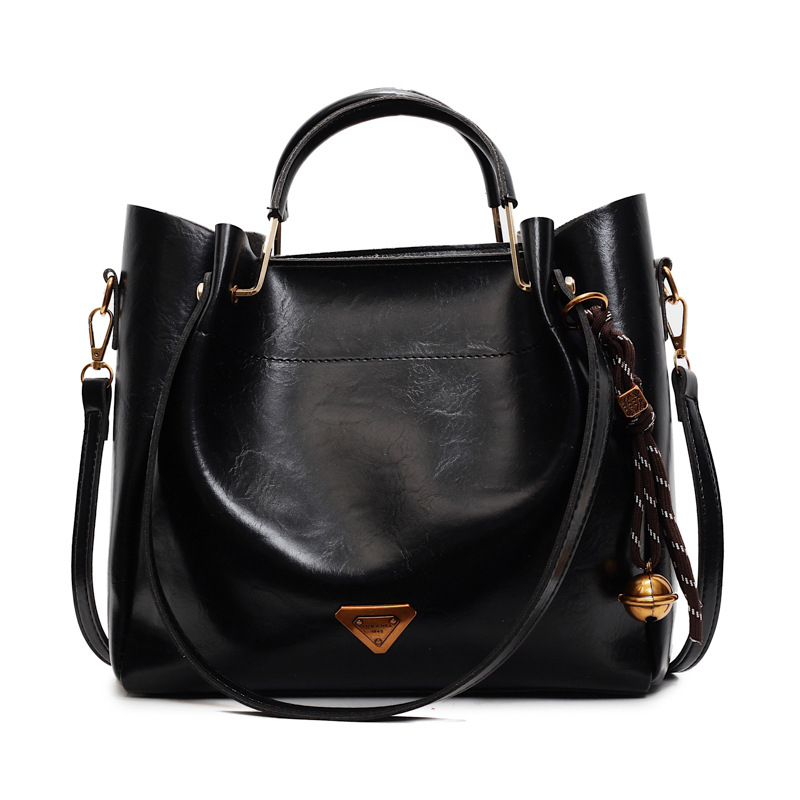 Ženska tote torba velike kapacitete — moderan, minimalistički retro stil, svestrana za nošenje preko ramena ili crossbody.
