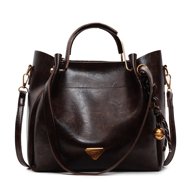 Ženska tote torba velike kapacitete — moderan, minimalistički retro stil, svestrana za nošenje preko ramena ili crossbody.