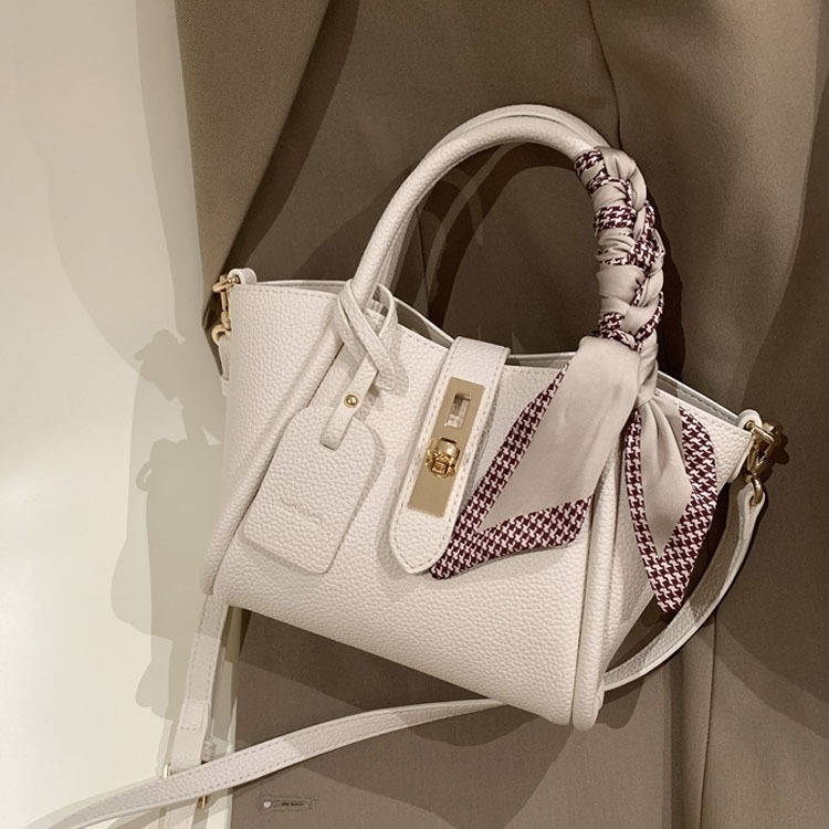 Nišna torbica s oblikom krila, TOGO tekstura, mala crossbody torbica
