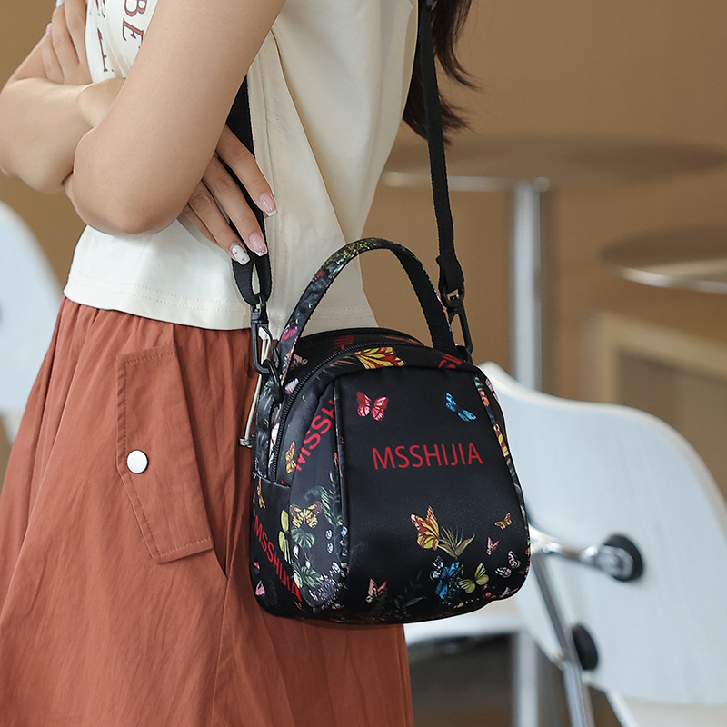 Nova lagana crossbody torbica s velikom kapacitetom, višestrukim džepovima, s odvojivom naramenicom i novčanikom, s motivom leptira i cvijeća