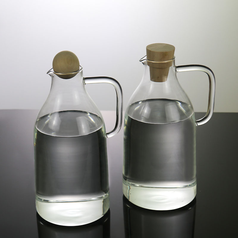 Ceainic din sticlă borosilicat rezistentă la temperaturi înalte, cu capac mare și mâner în stil ceainic, pentru apă rece și băuturi cu suc