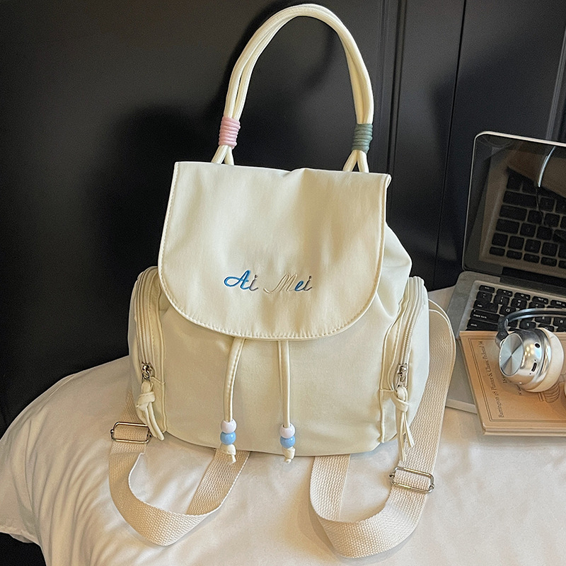 Ženski nylon ruksak s vezanjem, mali ovalni bucket bag za svakodnevnu upotrebu, ljeto 2025